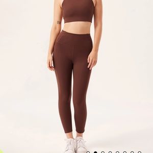 Girlfriend Collective earth colored tights. 23 3/4” inseam.